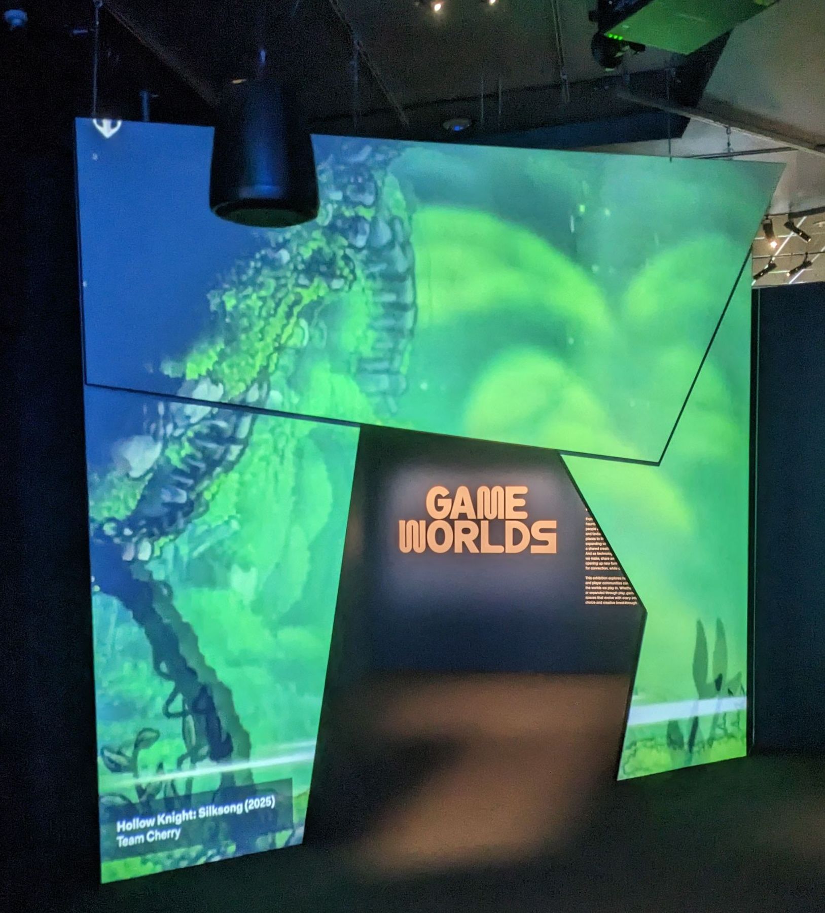 enterance of acmi game worlds with large LED display showing silksong enterance of acmi game worlds with large LED display showing silksong