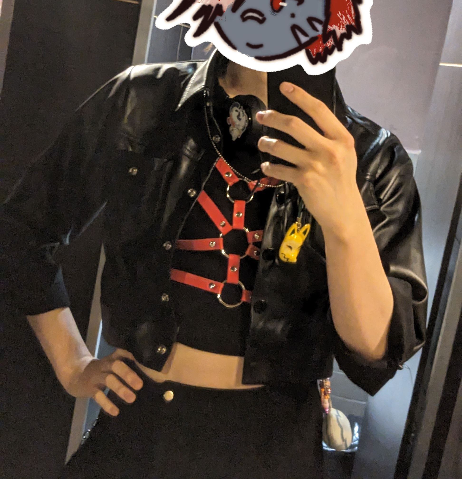 me in leather jacket and red harness over a cropped bra me in leather jacket and red harness over a cropped bra