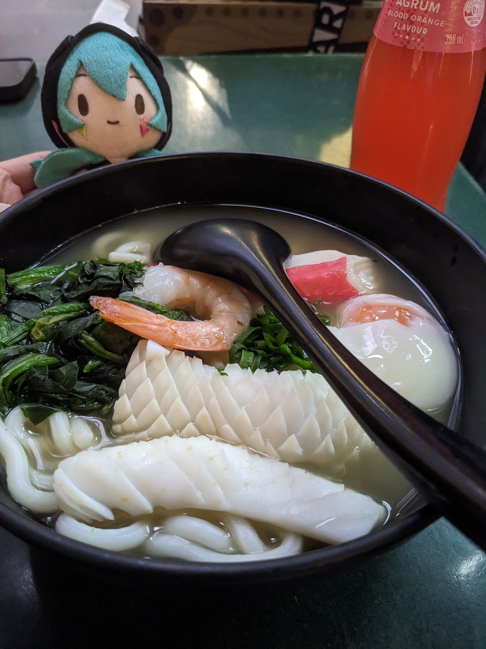 miku behind pot of seafood udon miku behind pot of seafood udon